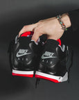 Nike Air Jordan 4 Retro Bred Reimagined sneakers alte in nero rosso - vista frontale