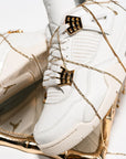 Nike Air Jordan 4 Retro Metallic Gold sneakers alte in bianco oro - indossate