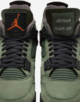 Nike Air Jordan 4 Retro Undefeated sneakers alte in grigio verde - indossate