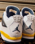 Nike Air Jordan 4 Retro Rare Air Tour Yellow sneakers alte in giallo nero - vista frontale