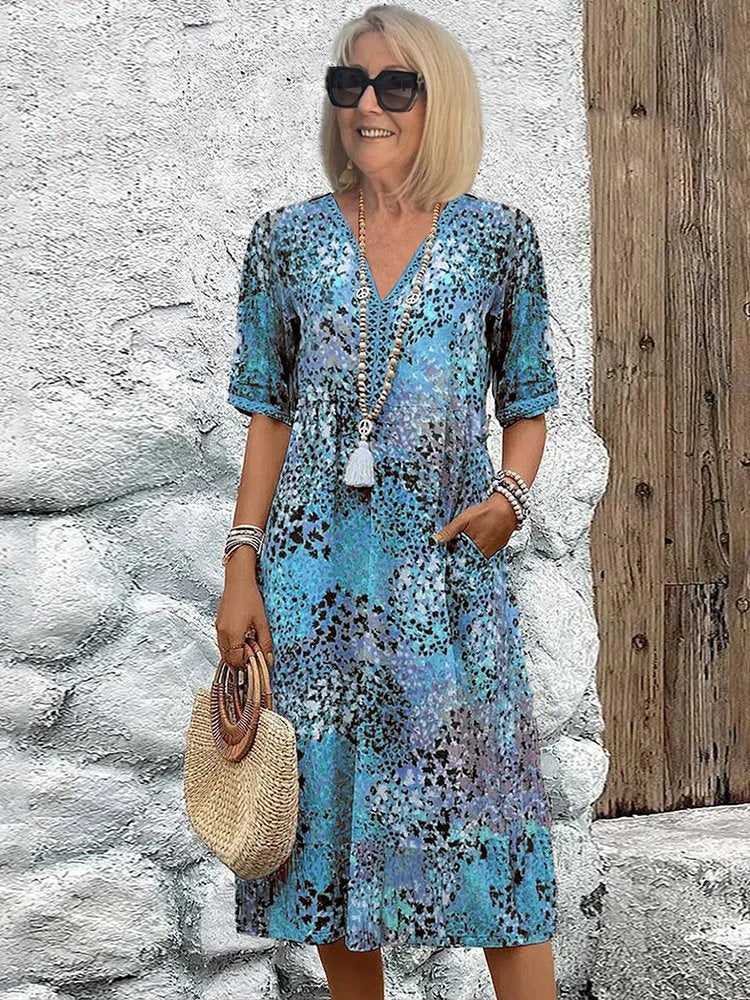 Emily | Vestito midi floreale con scollo a V e tasche per donna taglia plus