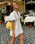 Abito mini donna bianco floreale in cotone – scollo a V, maniche a sbuffo, taglio a trapezio