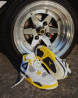 Nike Air Jordan 4 Retro Vivid Sulfur sneakers alte in giallo nero - dettaglio tallone
