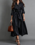 Dettaglio taglio svasato dell'abito lungo