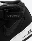 Nike Air Force 1 Mid Stussy Black White sneakers alte uomo e donna pelle bianco nero, indossate